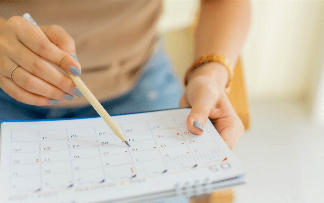 Woman checking the dates on her daily planner